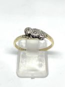 Vintage diamond three stone cross over ring stamped 9CT & PLAT, overall weight 1.
