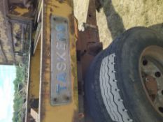 Yellow Tasker flatbed trailer