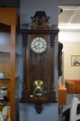Victorian Mahogany Framed Vienna Wall Clock with Walnut Veneer, Enamel Face, and Carved Detail