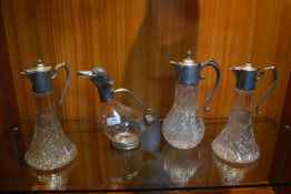 Four Cut Glass Claret Jugs with Pewter Spouts