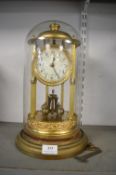 Brass Skeleton Clock in Glass Dome