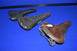 Three Bicycle Saddles by Brooks etc.