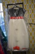 *Child’s Black and Cream dress with red waistband