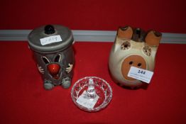 Two Pottery Moneyboxes and a Candle Stand
