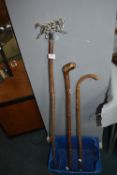 Three Walking Sticks Including One with Wolf Design