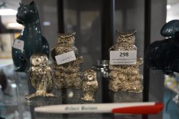 Four White Metal Owls