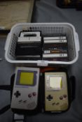 Two Nintendo Game Boys plus Cassette Tape Games