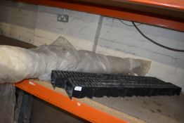 *Two Drainage Channels and a Roll of Polyethene