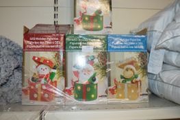 *Four LED Christmas Figurines