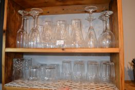 *Contents of Two Shelves to Include Various Glassware Including Branded Coca-Cola Glasses, Wine