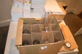 *Box of Champagne Flutes, and a Box of Tealight Holders with battery Powered Tealights