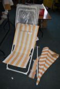 *Five Folding Lounge Chairs, and a Parasol