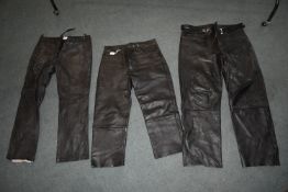 Three Pairs of Leather Motorbike Trousers (one pair distressed)