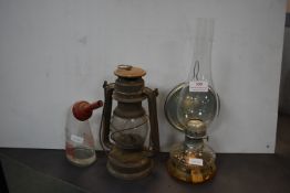 Four Paraffin Lamps and a Lucas Battery Filler Bottle