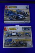 Two Sluban F1 Brick Sets