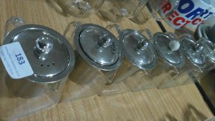 Six Small Glass Teapots