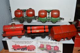Three Hornby O Gauge Goods Wagons, and Two Double Wine Wagons