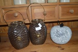 Two Glass Lanterns and a Mosaic Apple