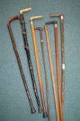 Seven Vintage Walking Sticks Including Two with Si