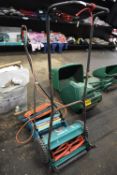 Bosch AHM38G Lawnmower, and a Black & Decker Electric Lawn Rake
