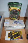 Harrier Jet Model Kit, Lord of the Rings Figure, and a Mini Munch Man Game
