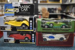 Four Diecast Cars Including 1936 and 1938 Classic Sports Car, Auburn Speedster, and a 1931 Stutz