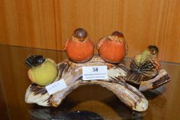 Four Pottery Birds on a Log