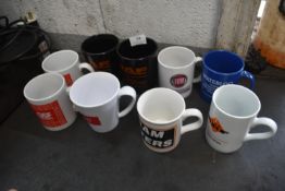 *Nine Assorted Branded Mugs