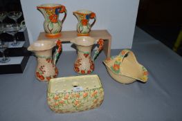 Six Floral Jugs and Planters