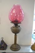Victorian Oil Lamp with Brass Base and Reservoir, and Cranberry Glass Shade