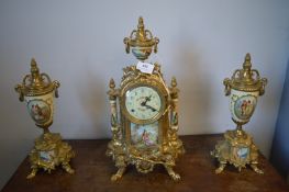 Continental Ormolu Clock with Enamelled Face and Panels, and Pair of Matching Garnitures