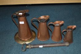 Set of Four Graduated Copper Jugs, Pump, etc.