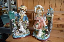 Pair of Figures of Children and Puppies