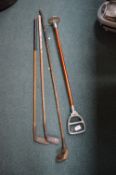 Three Hickory Golf Clubs and a Shooting Stick