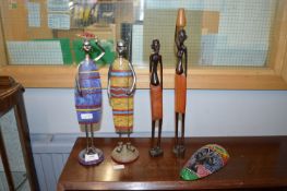 Four African Figures and a Small Mask