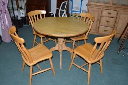 Light Wood Circular Table and Four Flatback Chair