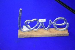 Silver Coloured Love Ornament on Wood Base