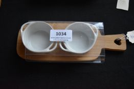 Pair of Ceramic Dishes on Bamboo Board