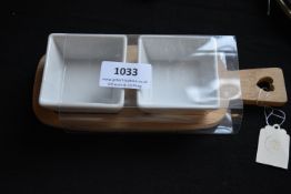 Pair of Ceramic Dishes on Bamboo Board