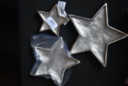 Three Silver Coloured Graduated Star Dishes