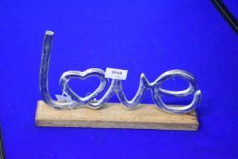 Silver Coloured Love Ornament on Wood Base