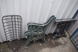 *Pair of Cast Iron Table Bases, Pair of Cast Iron Bench Ends, and a Plastic Coated Wire Flower