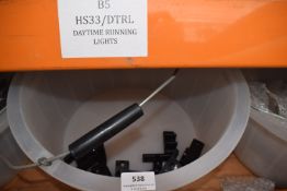 *Feed Bucket Containing Black Plastic Door Retainers