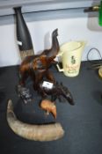 Carved African Animals and a Water Jug