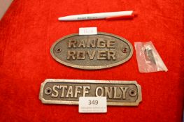 Two Cast Metal Signs
