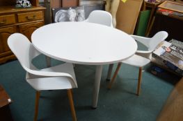White Circular Dining Table with Three Matching Ch