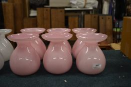 Six Pink Glass Vases