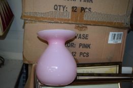 Twelve Pink Glass Vases
