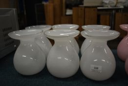 Six White Glass Vases