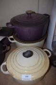 One White and One Purple Size: 24 and One White Size: 20 Le Creuset Pots